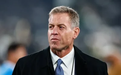 NFL Legends Grieve Together: Terrell Owens and Troy Aikman Honor Coach Gary Jackson